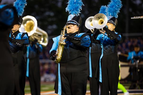 The Centennial High marching band performs